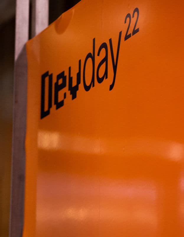 DevDay22 logo written in black text over an orange plastic banner.